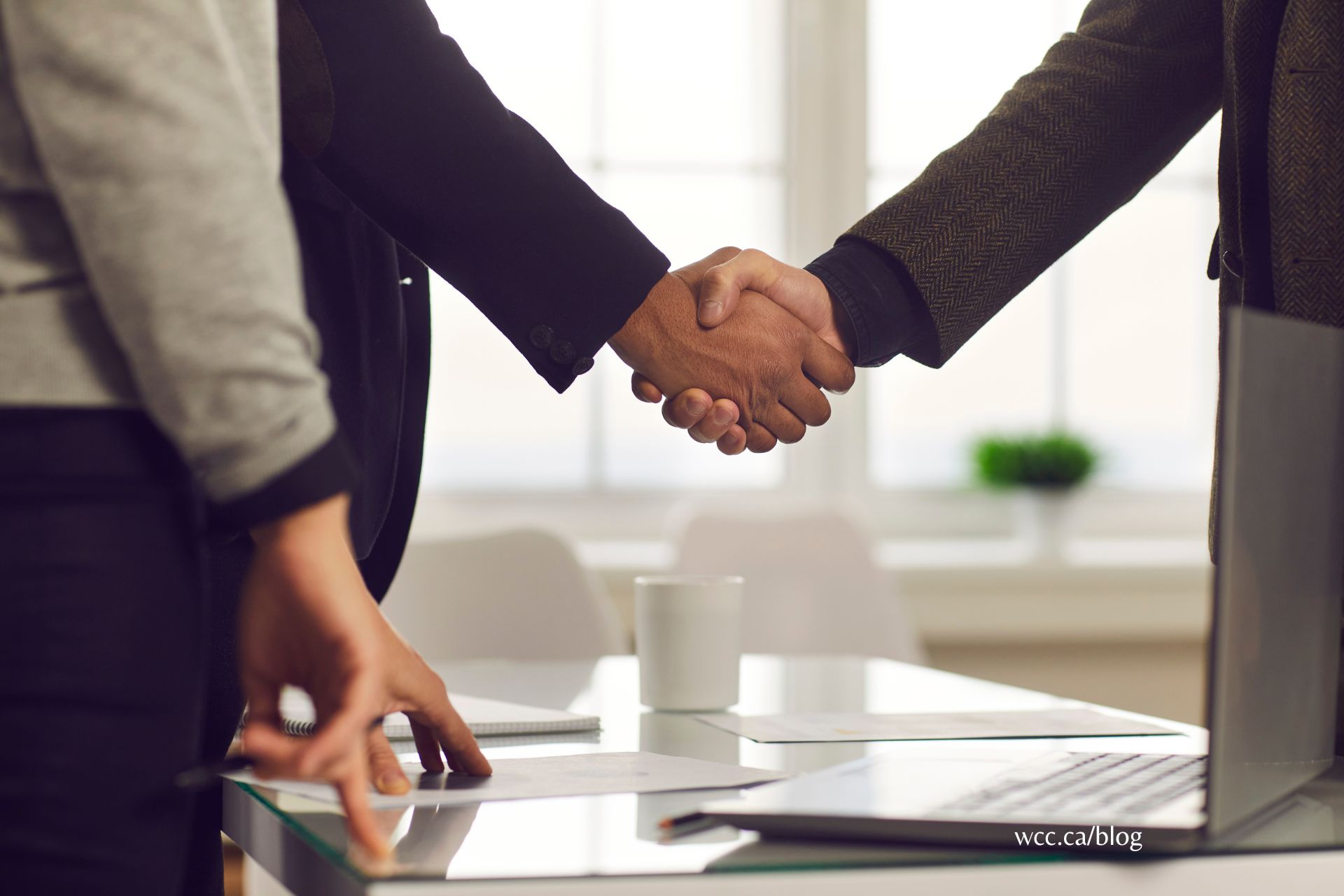 A diverse group of international business professionals collaborating around a table.