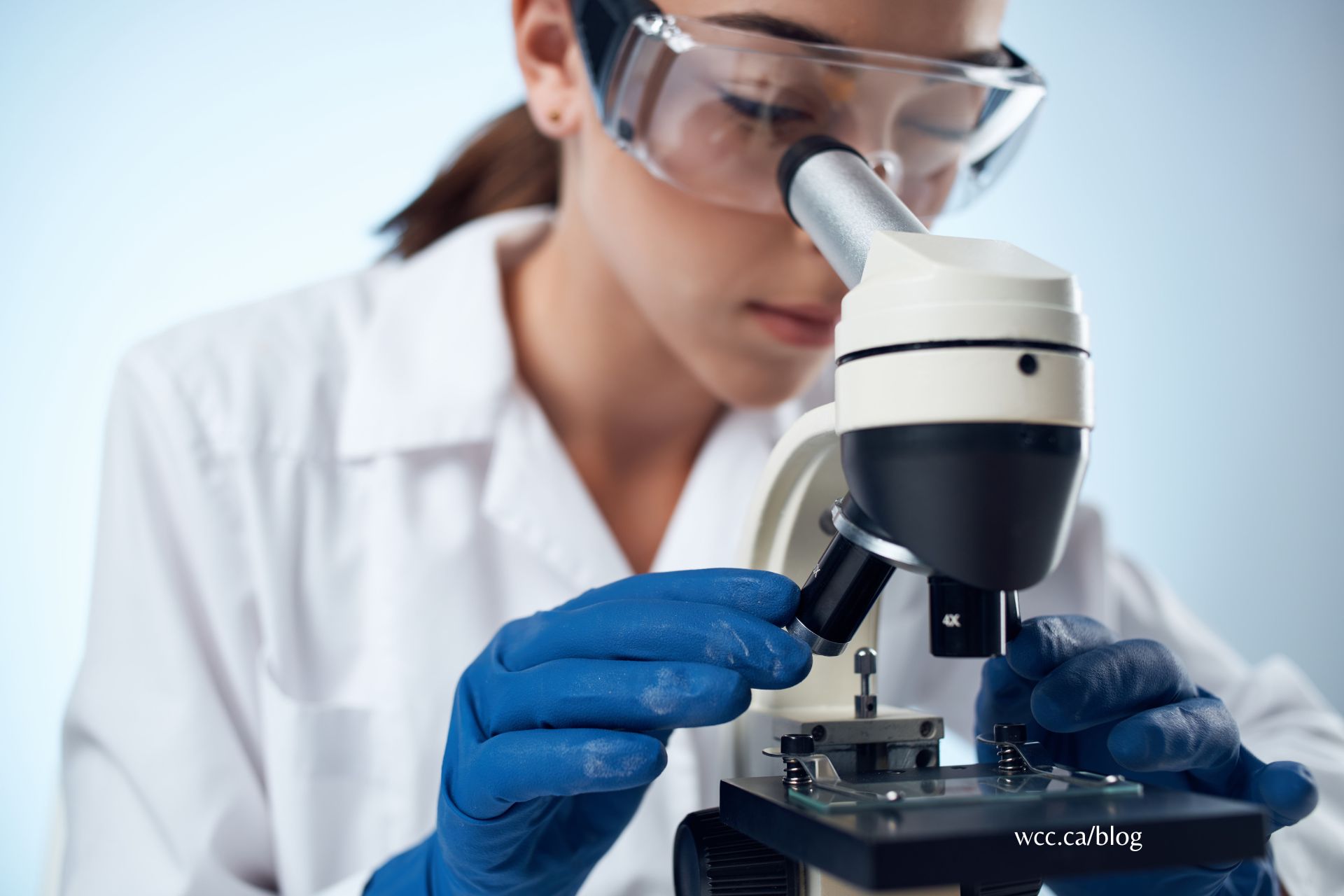 Medical laboratory assistant performing a lab test with equipment.