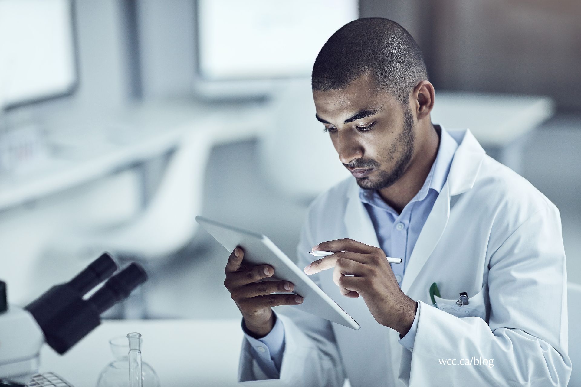 An image of a lab assistant wearing his lab coat